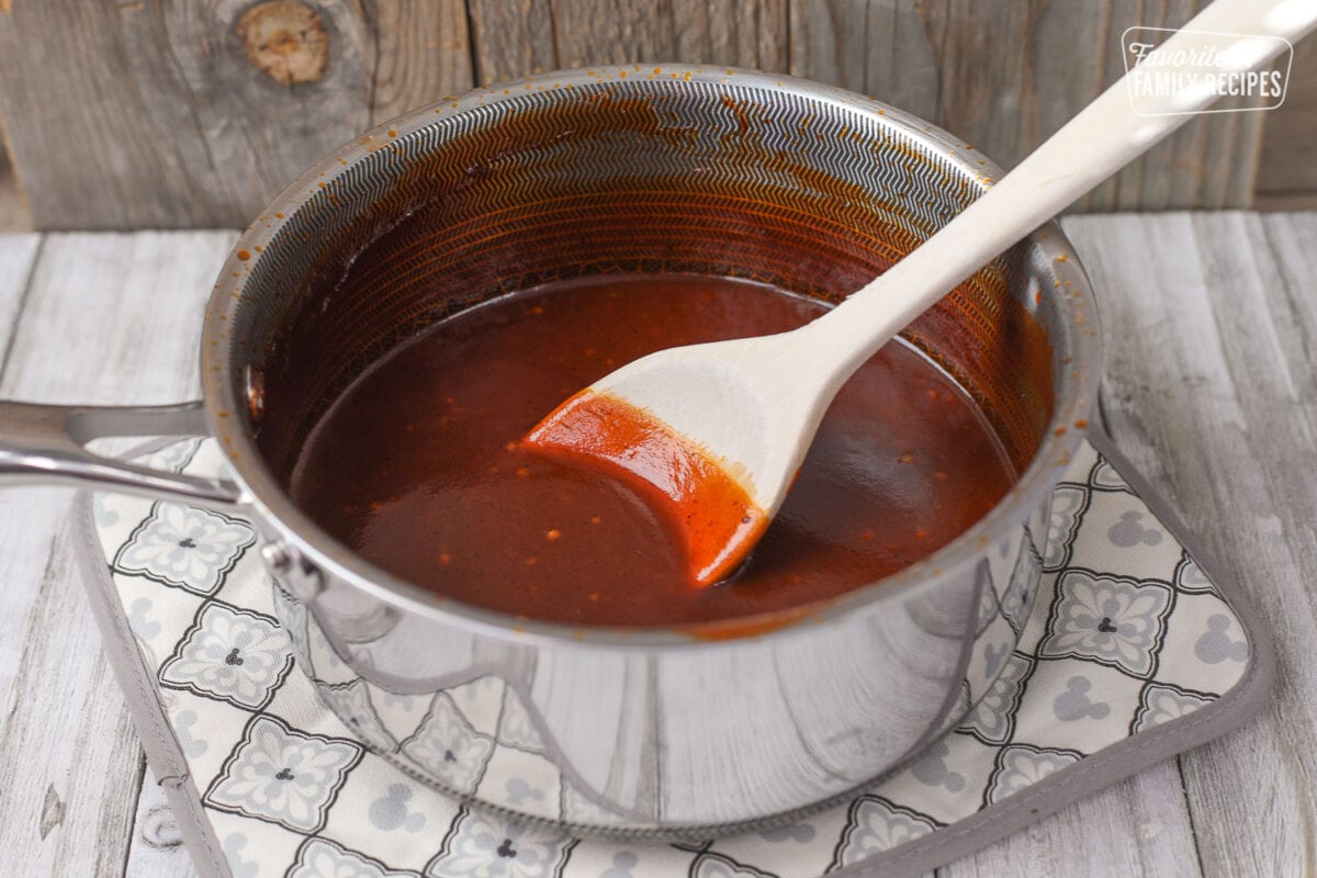 Sauce Pan of homemade BBQ Sauce on a pot holder