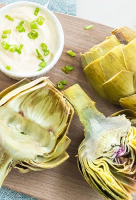 Cooked artichokes on a cutting board