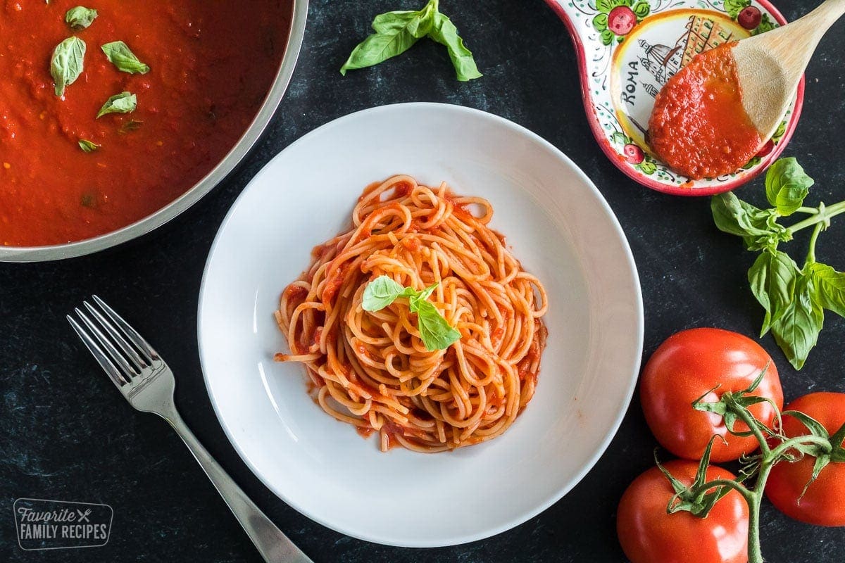 A plate of spaghetti with pomodoro sauce