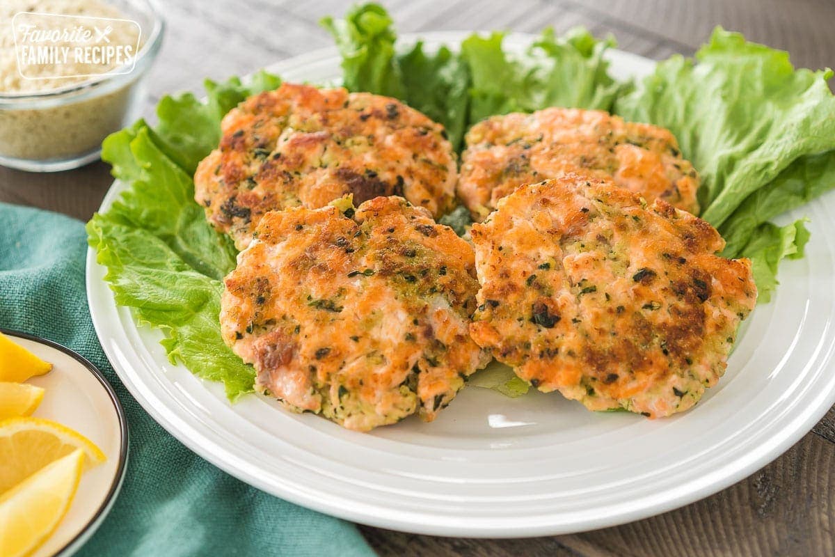 4 salmon patties on a bed of lettuce
