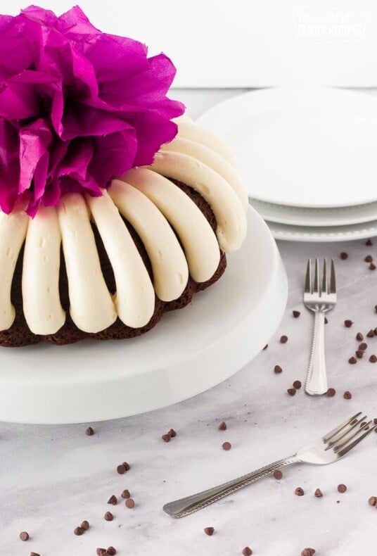 Purple pom pom on top of a Chocolate Nothing Bundt Cake.