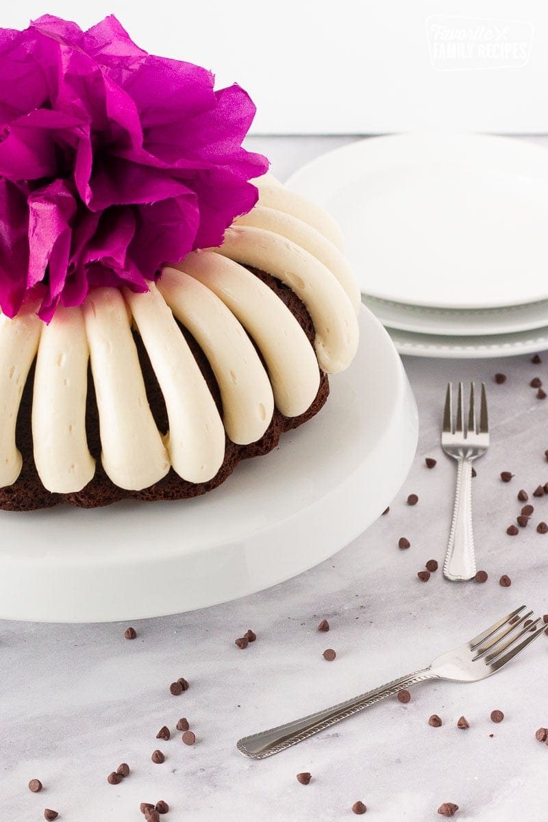 Purple pom pom on top of a Chocolate Nothing Bundt Cake.