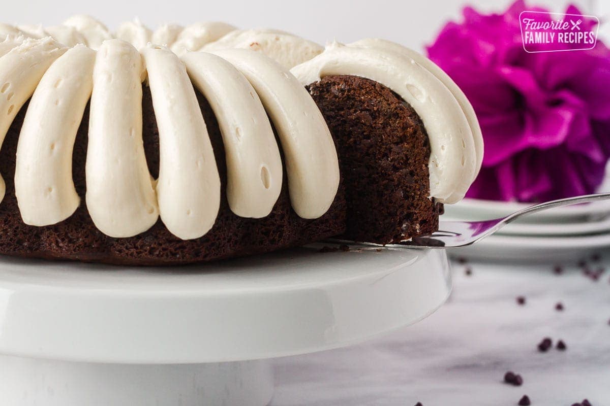 Spatula removing a slice of Chocolate Nothing Bundt Cake.