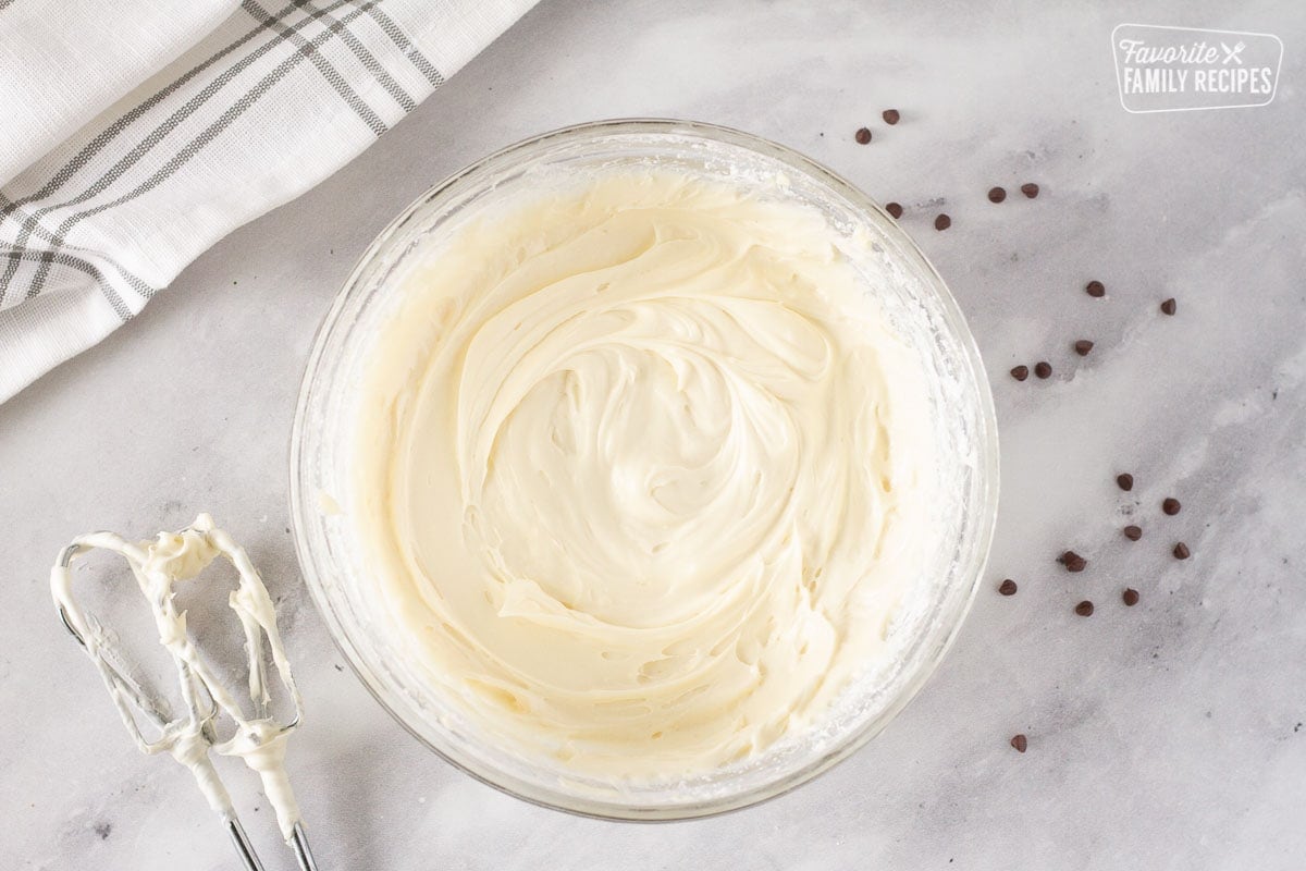 Cream cheese frosting in a mixing bowl to frost the Chocolate Nothing Bundt Cake