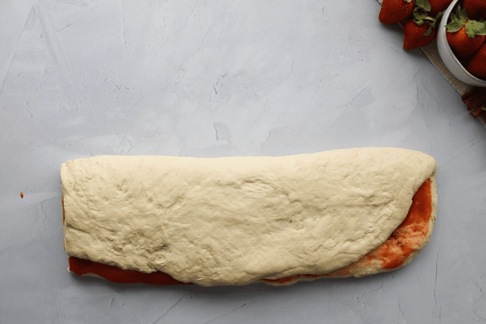 Dough folded in half for Strawberry Cinnamon Twists.