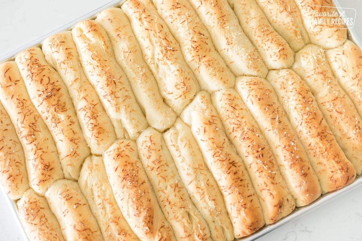 A large pan with baked breadsticks