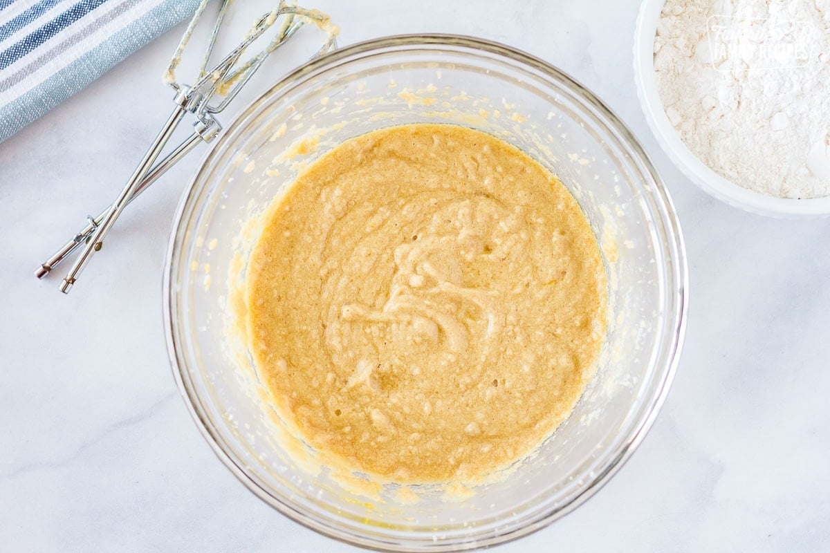 Mixing bowl with mixture of sugar, butter, vanilla and eggs to make the dough for easy fruit pizza.