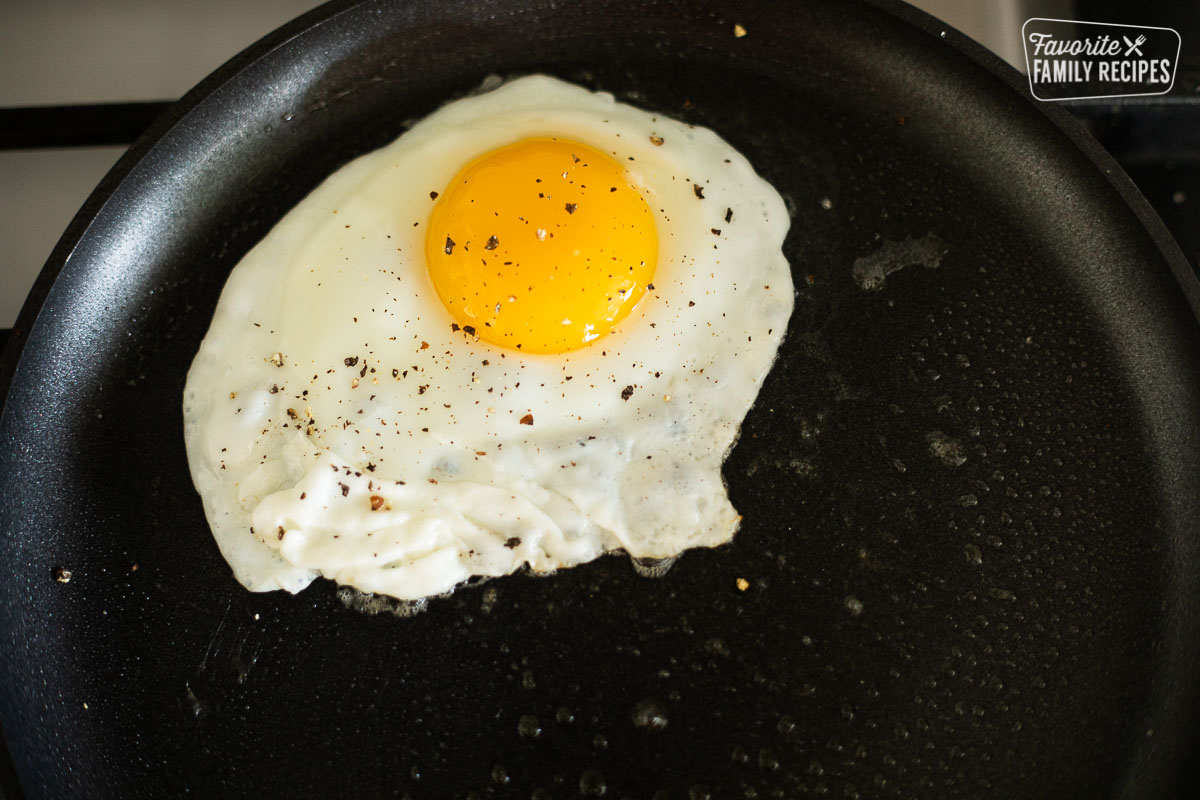 A sunny side up egg in a frying pan