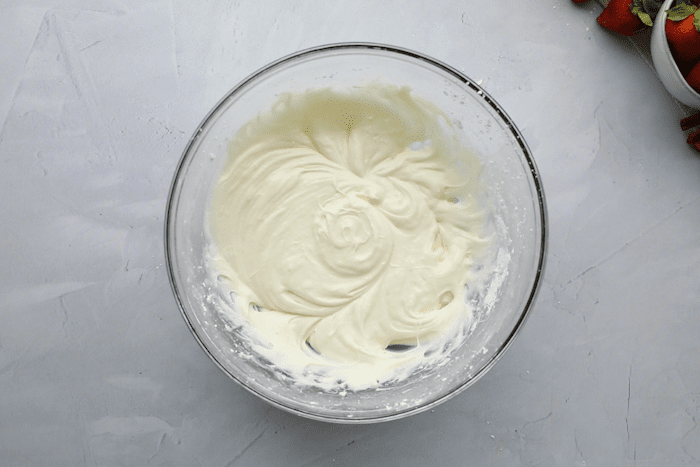 Frosting ingredients mixed in a bowl for Strawberry Cinnamon Twists.