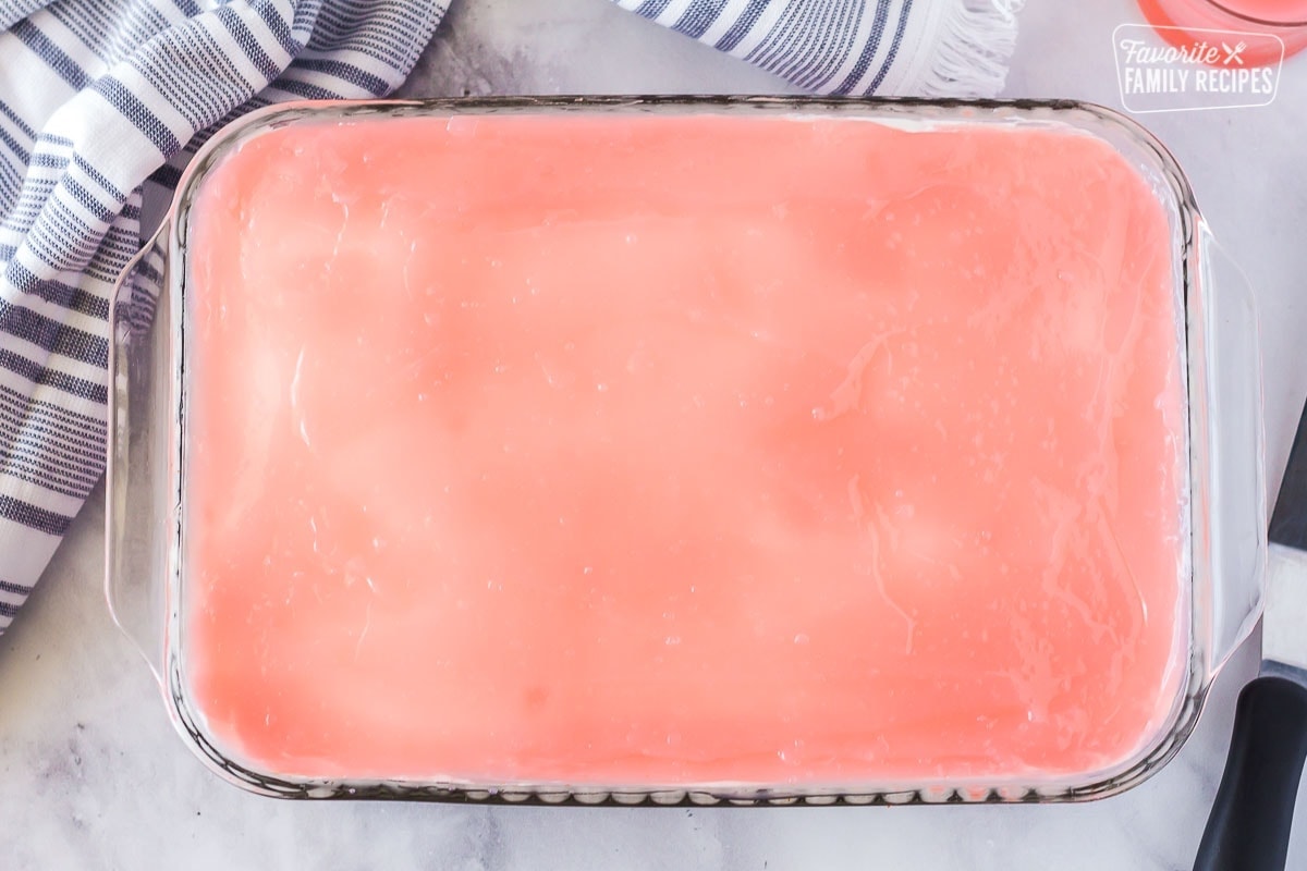Full 9x13 dish of Hawaiian guava cake with the finished pink glaze on top.