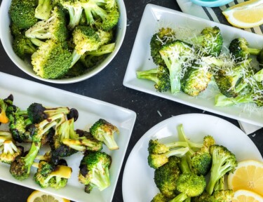 Four plates of broccoli each of them showing a different cooking method including steamed, roasted, sautéed, and air fried