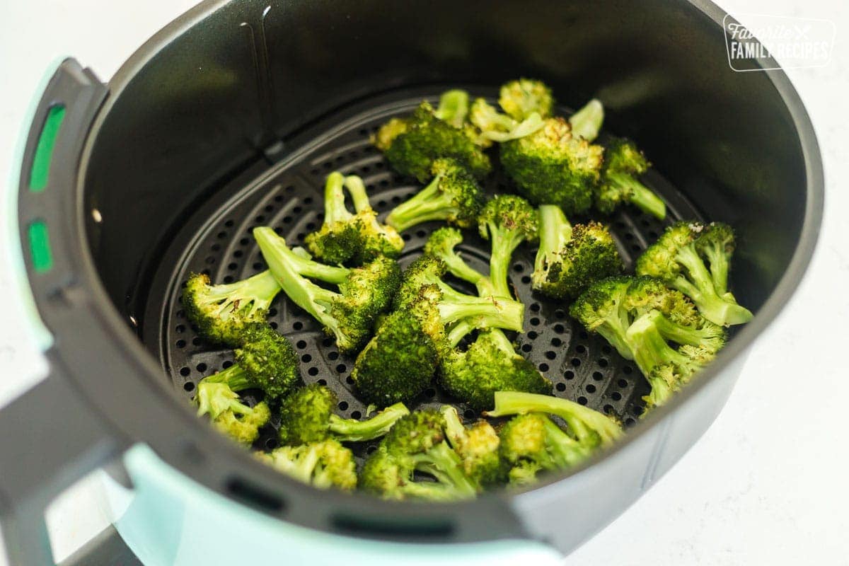 Cooked broccoli in an Air Fryer basket