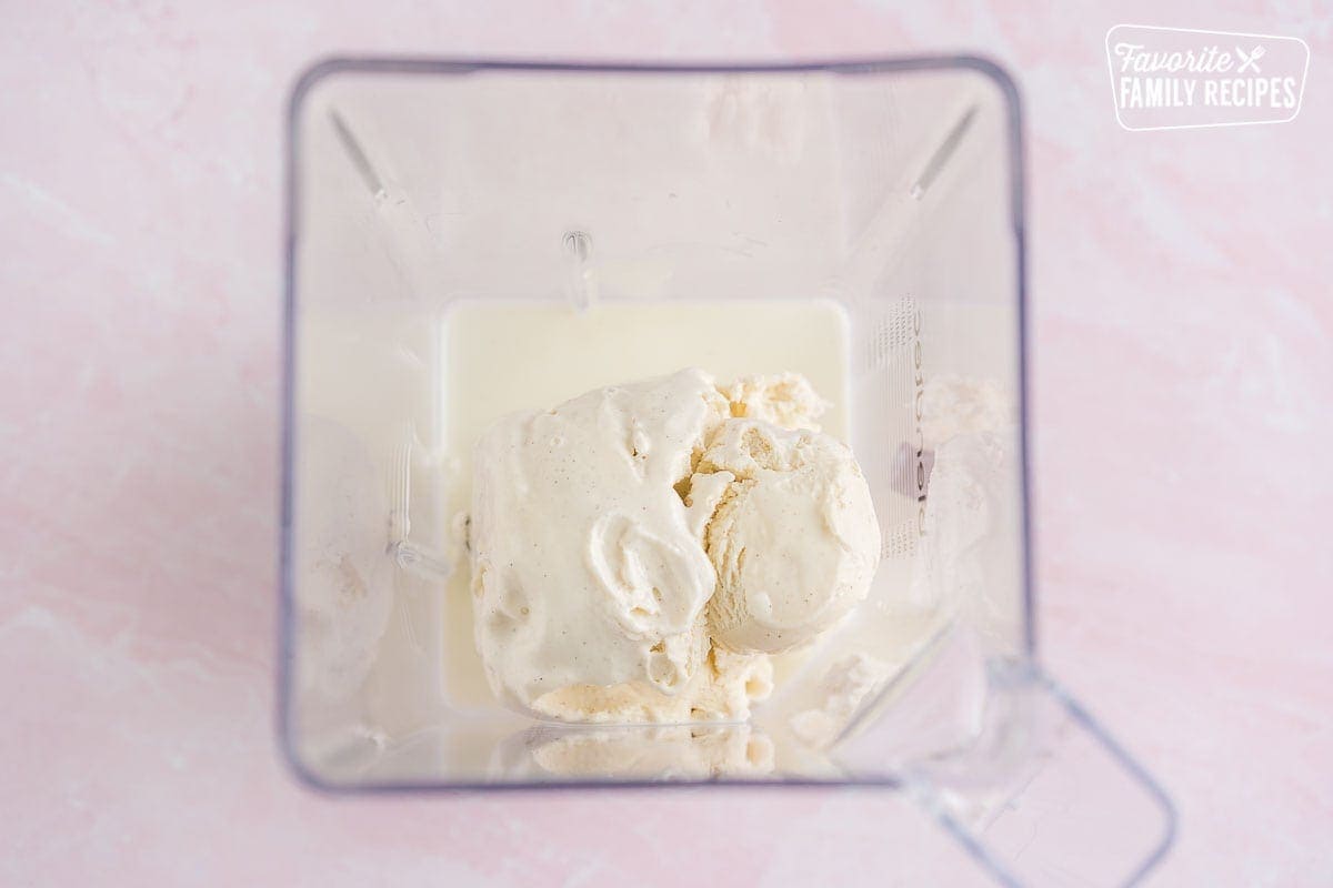Vanilla ice cream and milk in a blender