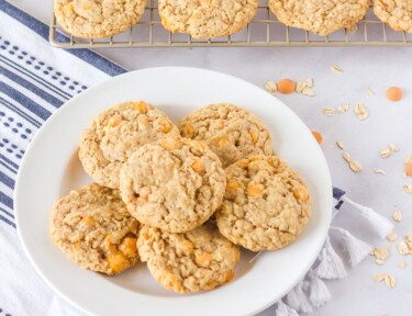 Plate and cooling wrack full of Oatmeal Butterscotch Cookies.