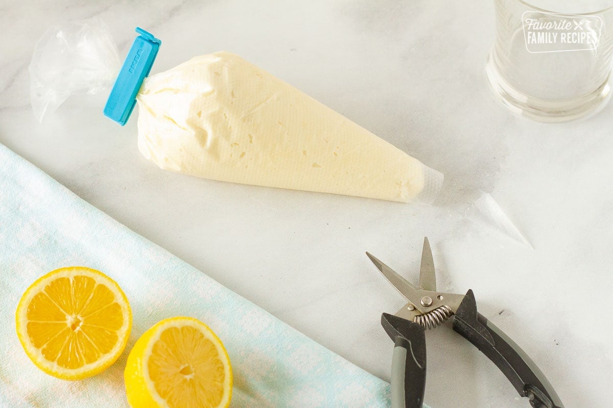 Cutting the tip of the piping bag for Lemon Nothing Bundt Cake.