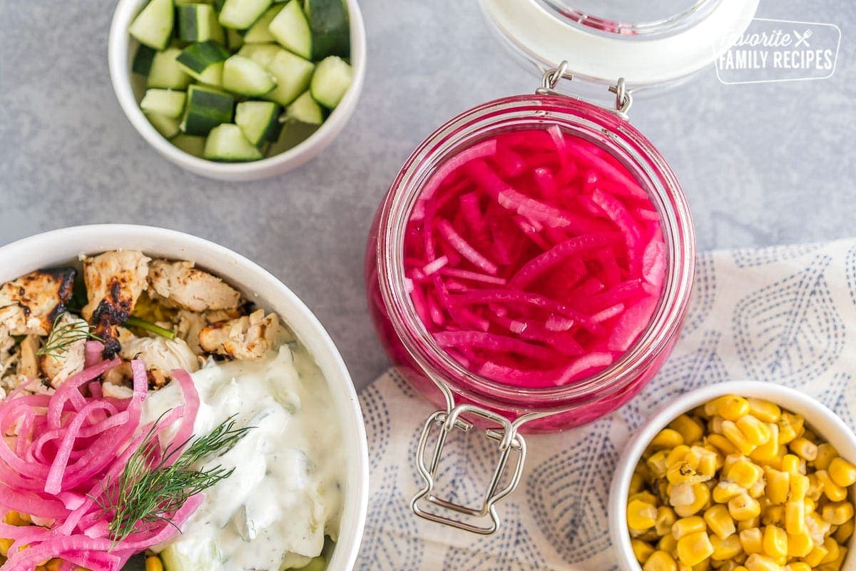 A jar of pickled red onions.