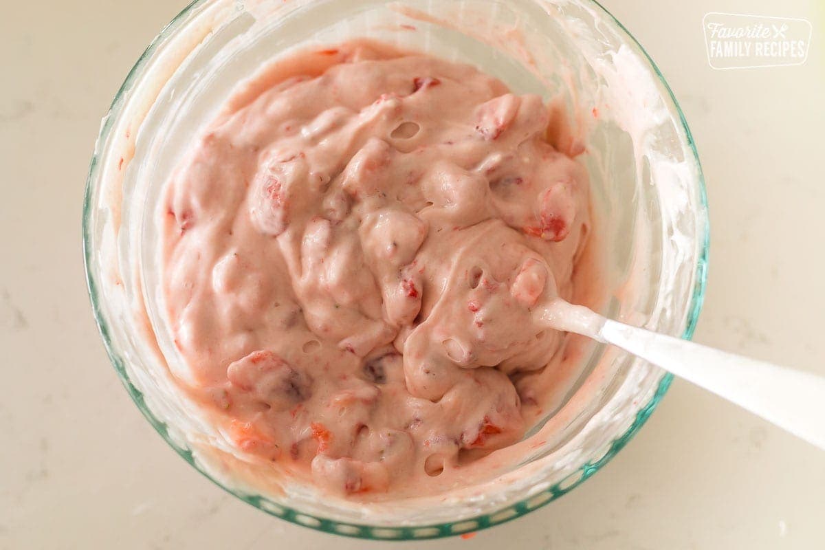 A bowl of strawberry cream cheese filling for crepes