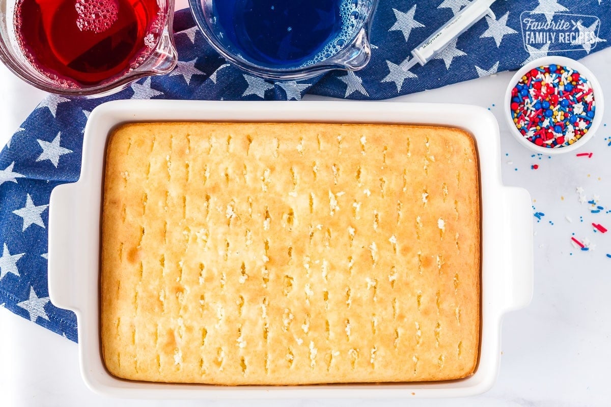 Holes poked in the top of a cake for 4th of July Cake.