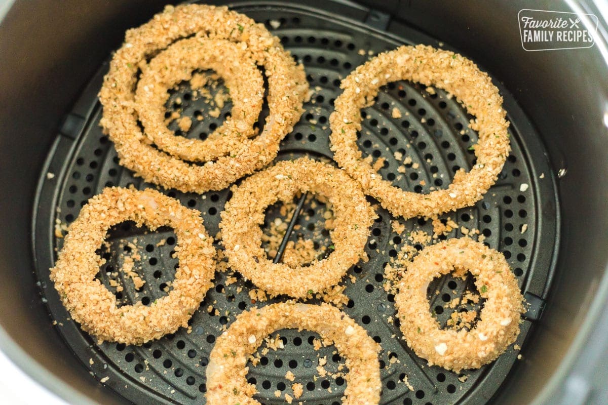 Onion rings in an air fryer basket