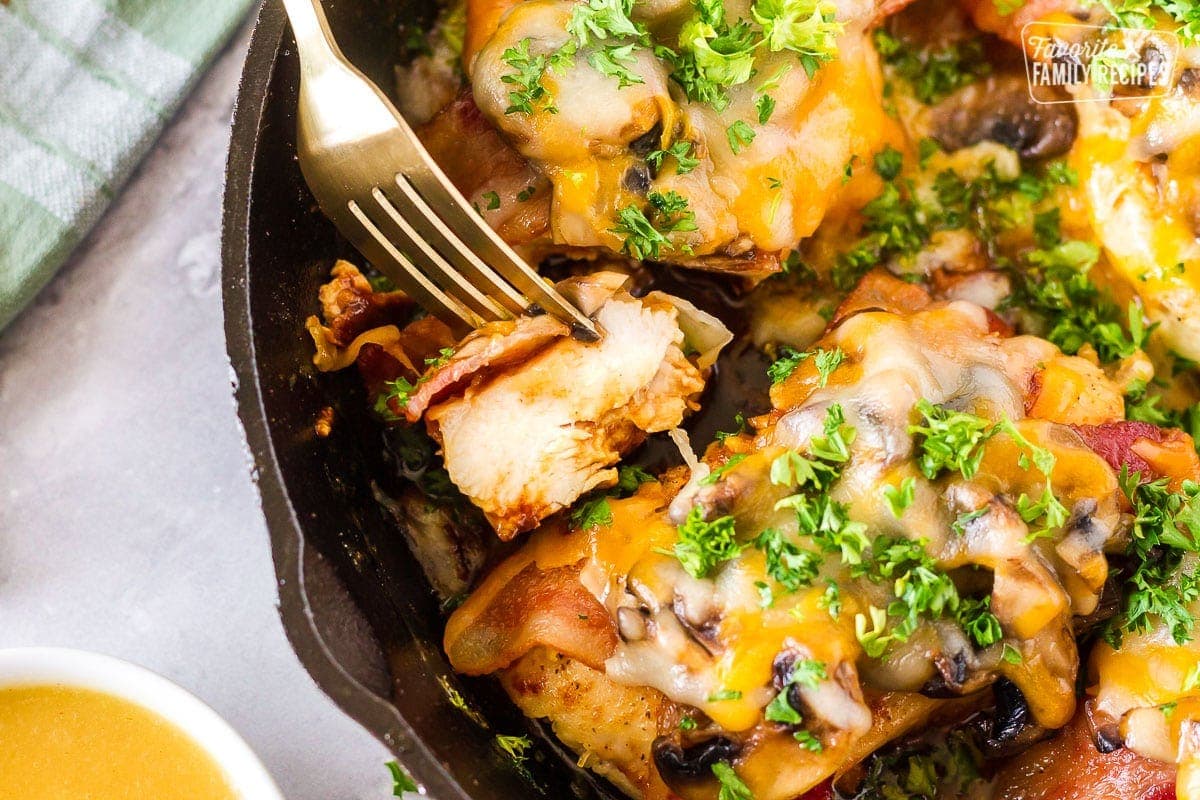 Alice Springs Chicken is a yummy cheesy, bacon and mushroom, delicious hot mess. There is so much flavor in every bite, no wonder it is one of the most popular dishes on the menu at Outback Steakhouse. You won't believe how easy this Alice Springs Chicken recipe is to make! Cut of Alice Springs Chicken.