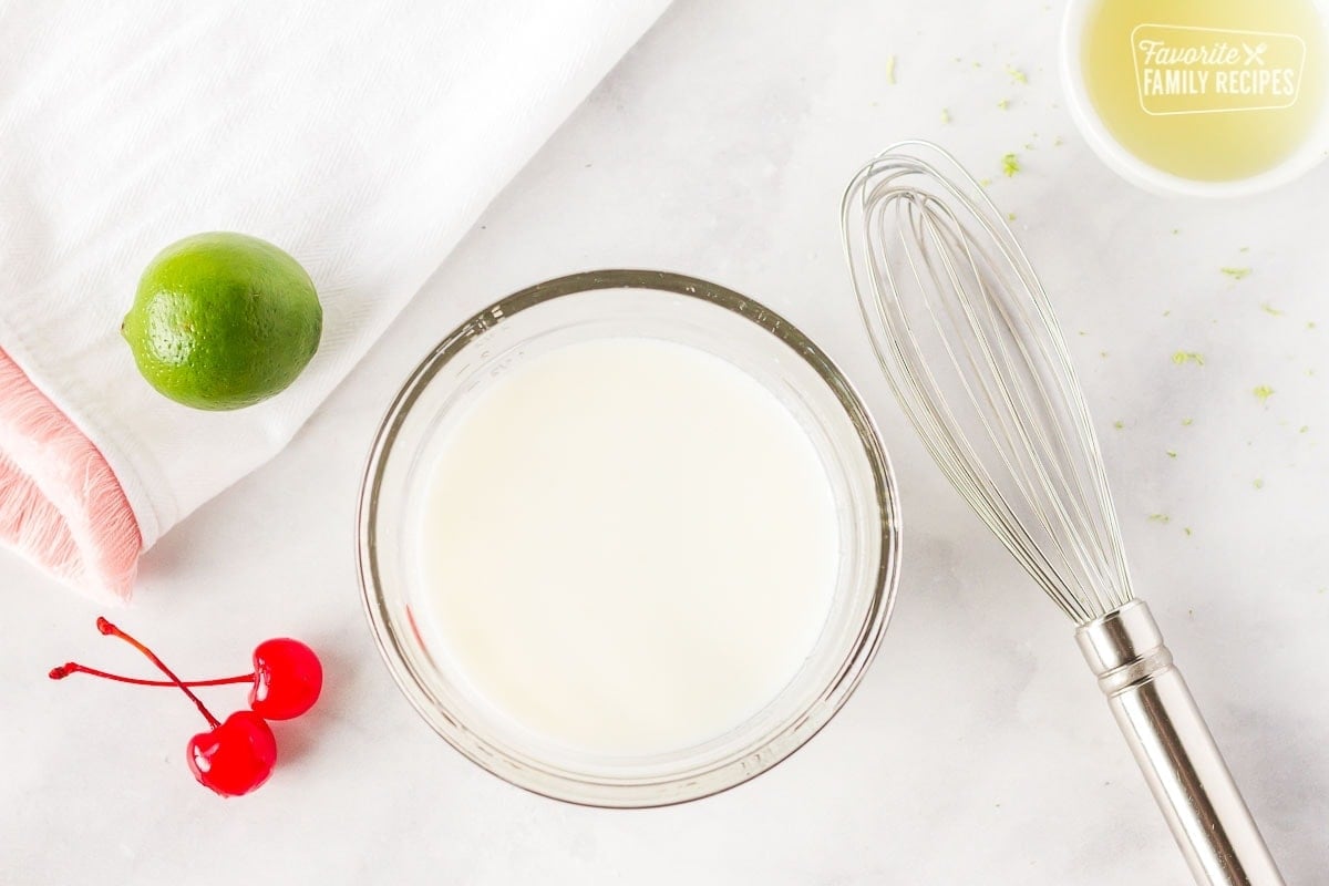 Buttermilk and lime juice whisked together for Cherry Limeade Cupcakes.