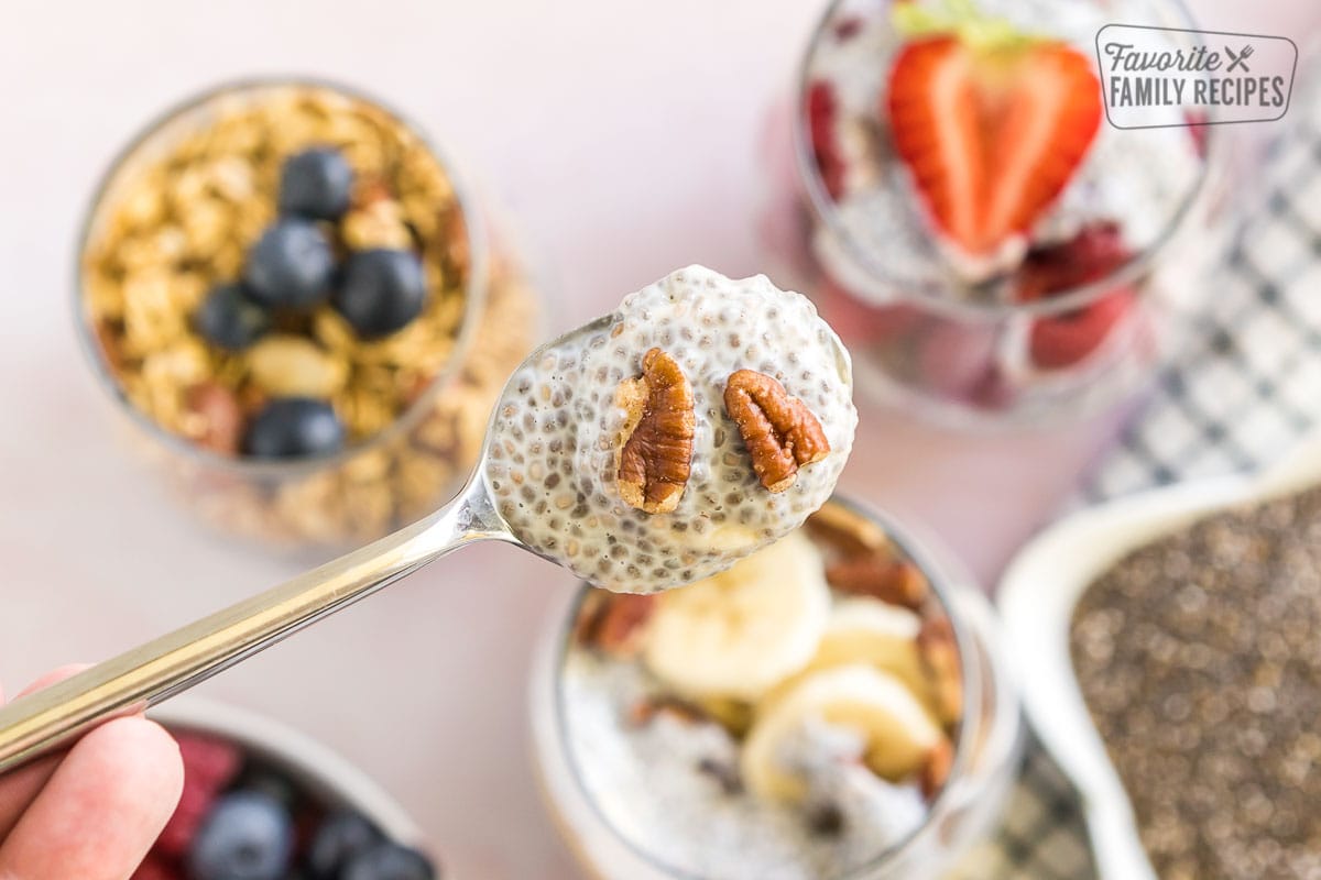 A spoonful of Chia Seed Pudding with pecans on top