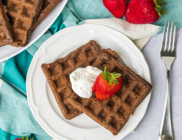Chocolate Waffles with strawberries and whipped cream