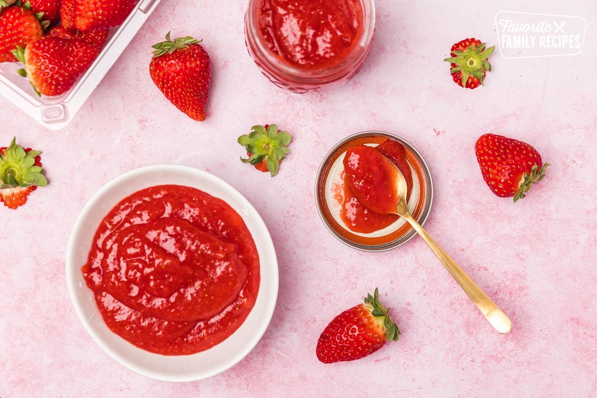 Processed strawberries in bowl and jar
