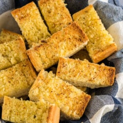 A basket full of sliced garlic bread