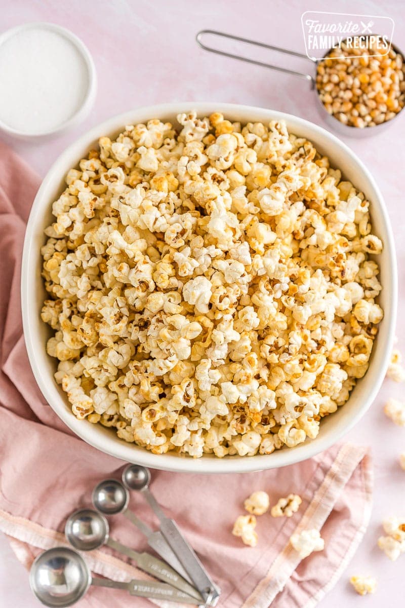 A large white bowl full of kettle corn