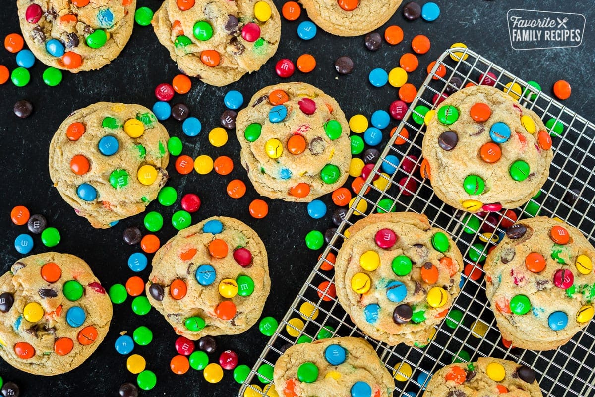 A dozen M&M cookies on a black background to show vibrant colors of candies