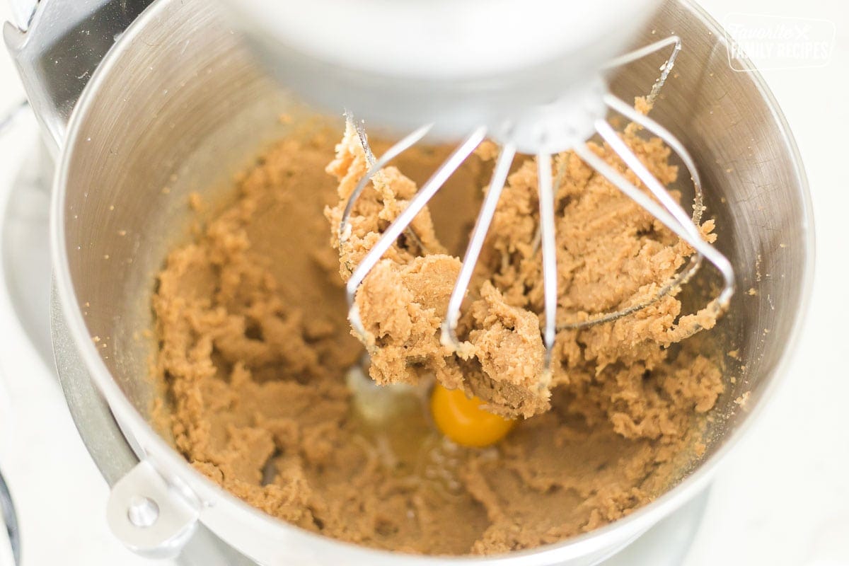 A mixing bowl on a stand mixer with cookie dough