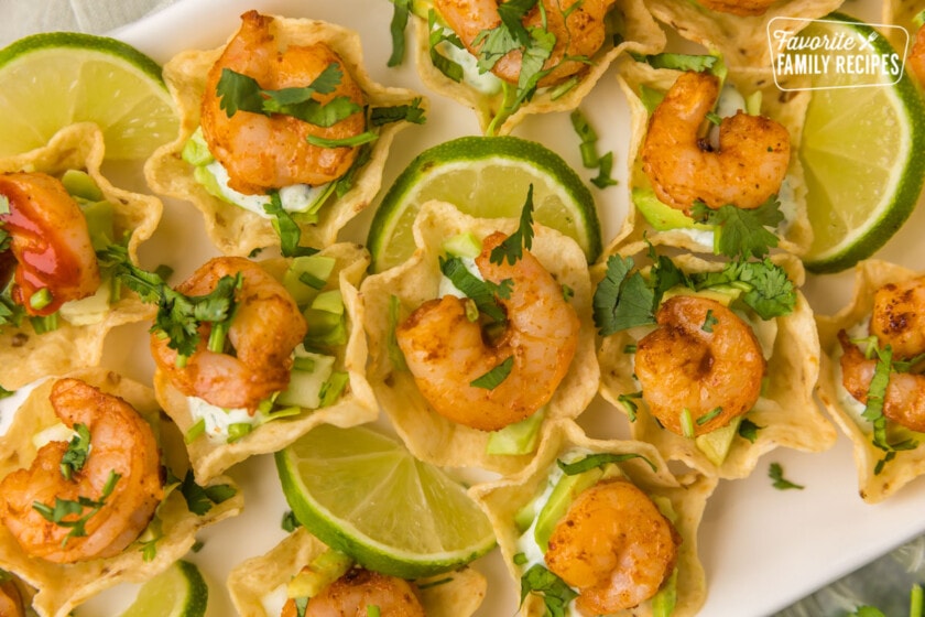 Plated shrimp taco bites with limes