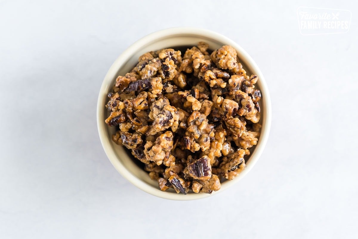 Candied pecans in a small round dish.