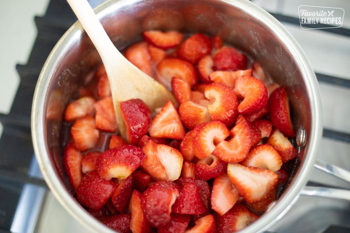 Cut up strawberries in a sauce pan