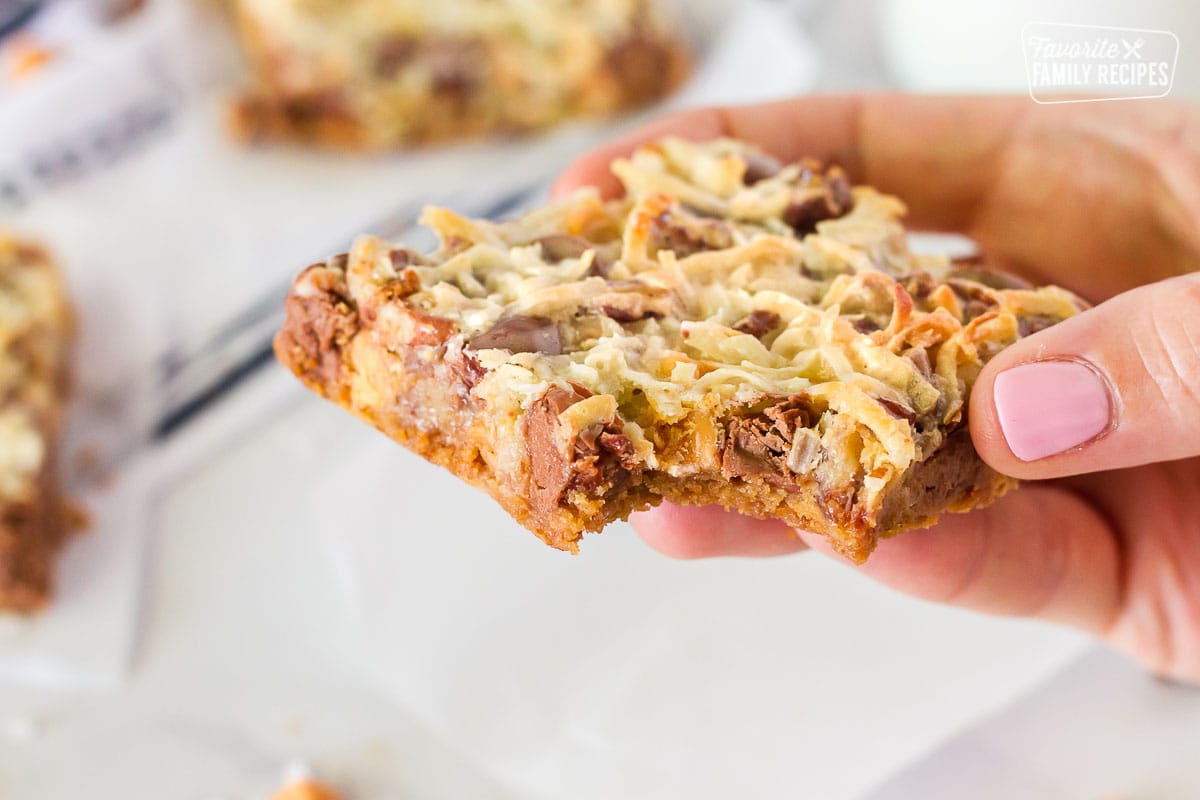Bite out of single 7 Layer Magic Cookie Bar.