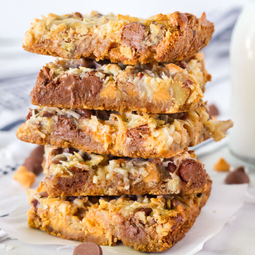 Tall stack of 7 Layer Magic Cookie Bars.