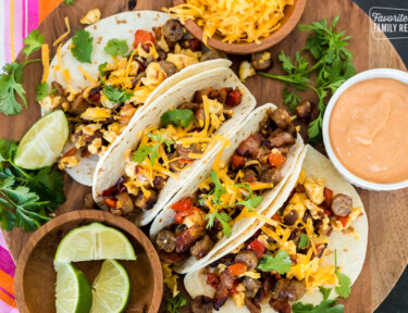 A top view of four breakfast tacos on a platter