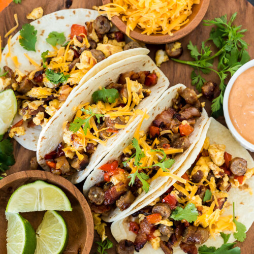 A top view of four breakfast tacos on a platter