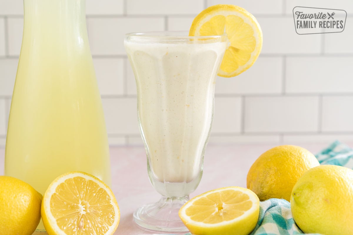 Chick Fil A Frozen Lemonade in a tall glass garnished with a lemon slice