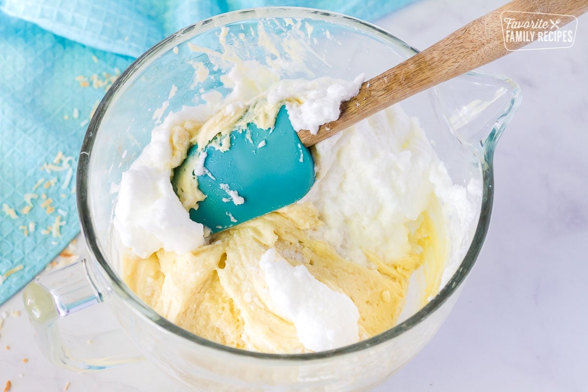 Egg whites added to coconut cream cake batter.