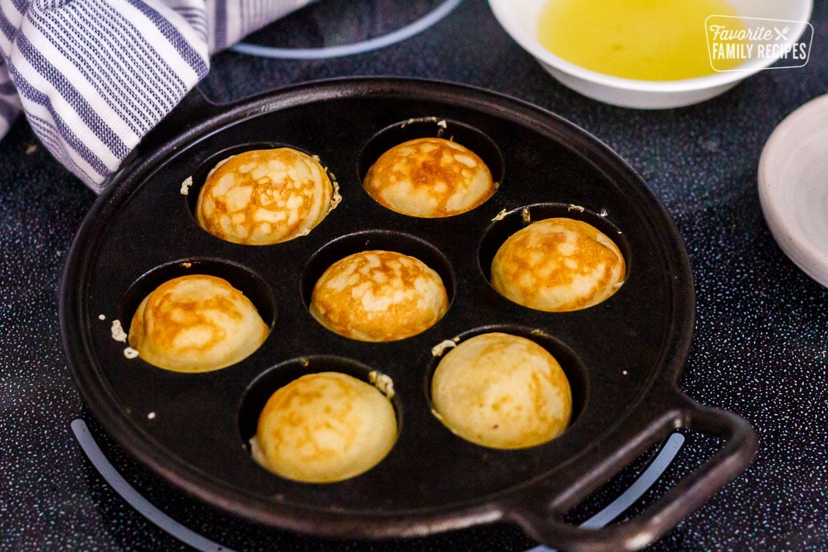 Baked Danish Aebleskiver in pan.