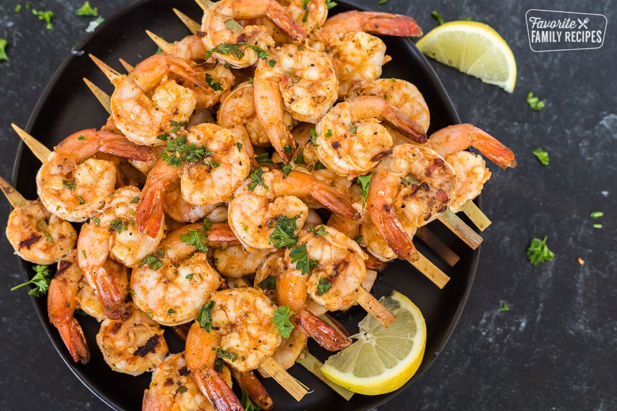 Skewered marinated grilled shrimp on a plate