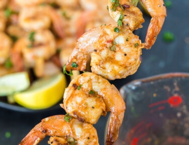 A skewer of four marinated grilled shrimp
