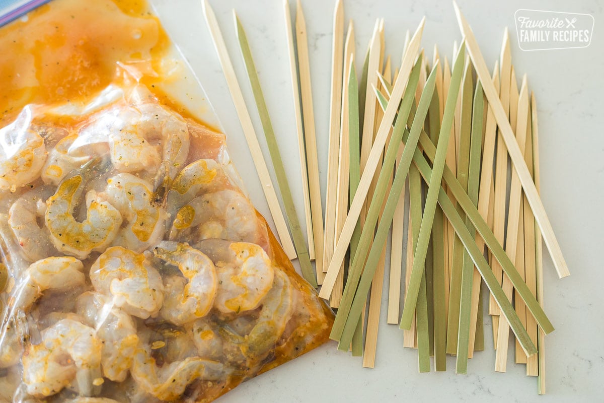 A pile of bamboo skewers for marinated shrimp