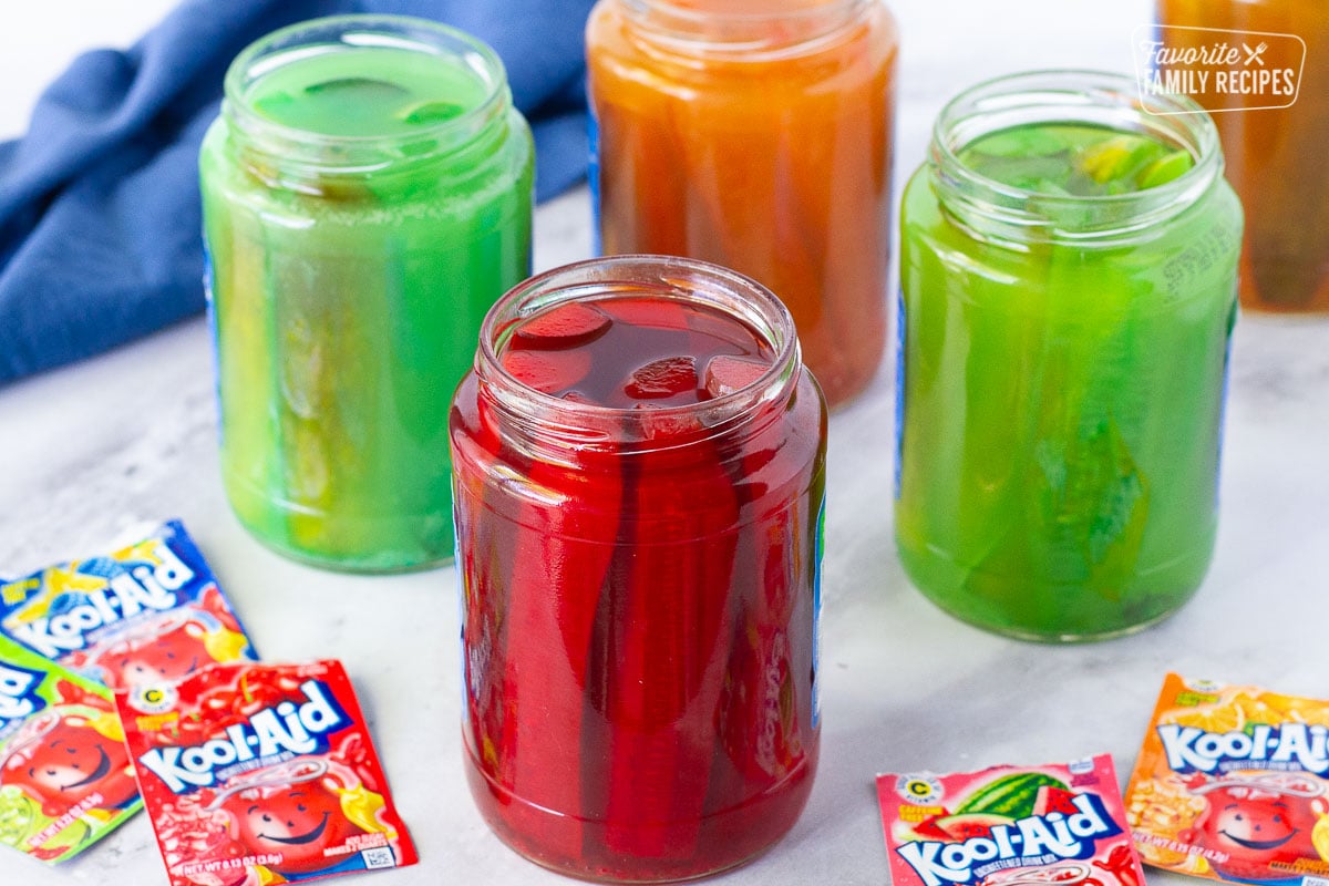 Opened jars of Kool Aid Pickles.