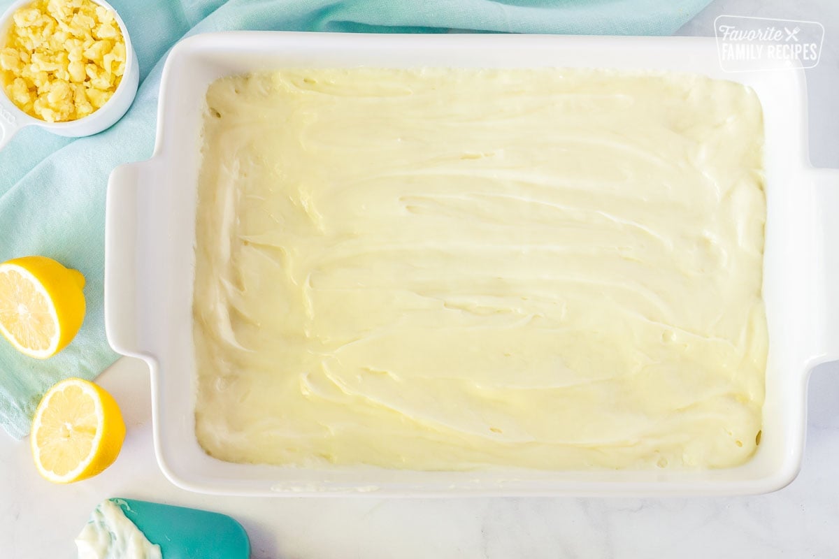 Lemon Cream Cheese Bars layer on top of crust in a 9x13 pan.