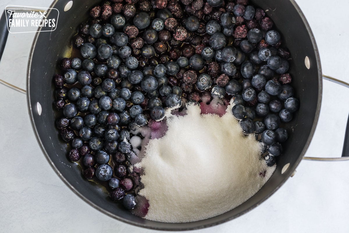 Blueberries and sugar in a large stock pot.