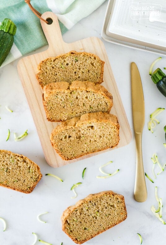 Wooden board with sliced Mom's Zucchini Bread.