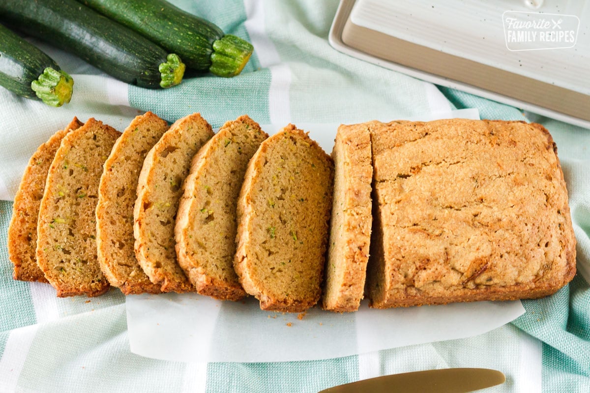 Our Mom’s Zucchini Bread recipe is a no-fail, easy recipe. Moist and flavorful on the inside with a slightly crispy crust outside. Perfection! Top view of sliced Mom's Zucchini Bread.